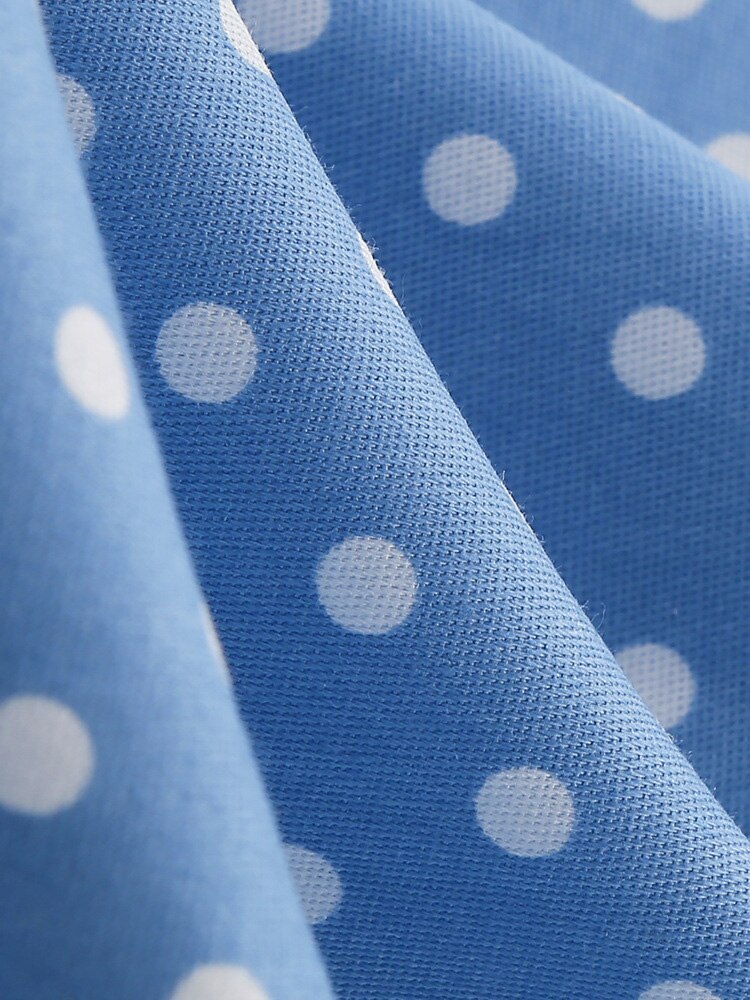 Blaues Neckholder Kleid mit weißen Punkten im 50er & 60er Jahre Stil